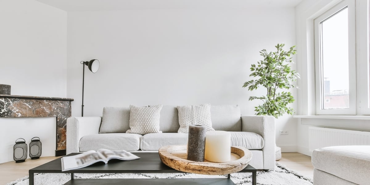 Occupied apartment living room interior with couch and coffee table