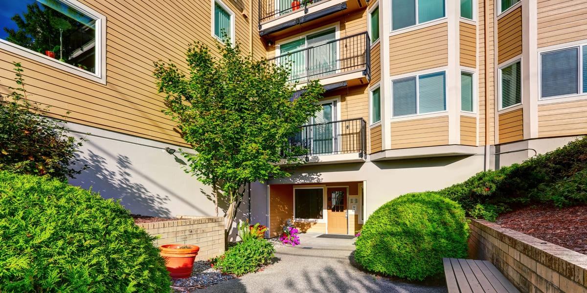 Seattle, Washington apartment exterior with landscaping on walkway
