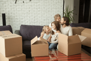 Smiling tenants unpacking after moving into a property in South Puget Sound, WA